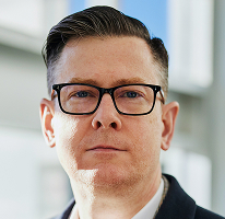 Photo d'Alexander Hughes, directeur général d'une entreprise de trading de cryptomonnaies